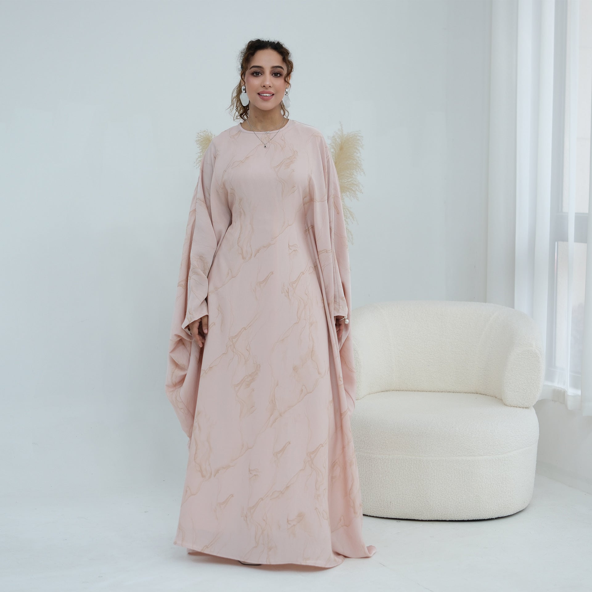 Flowing hem detail of batwing sleeve abaya maxi dress
