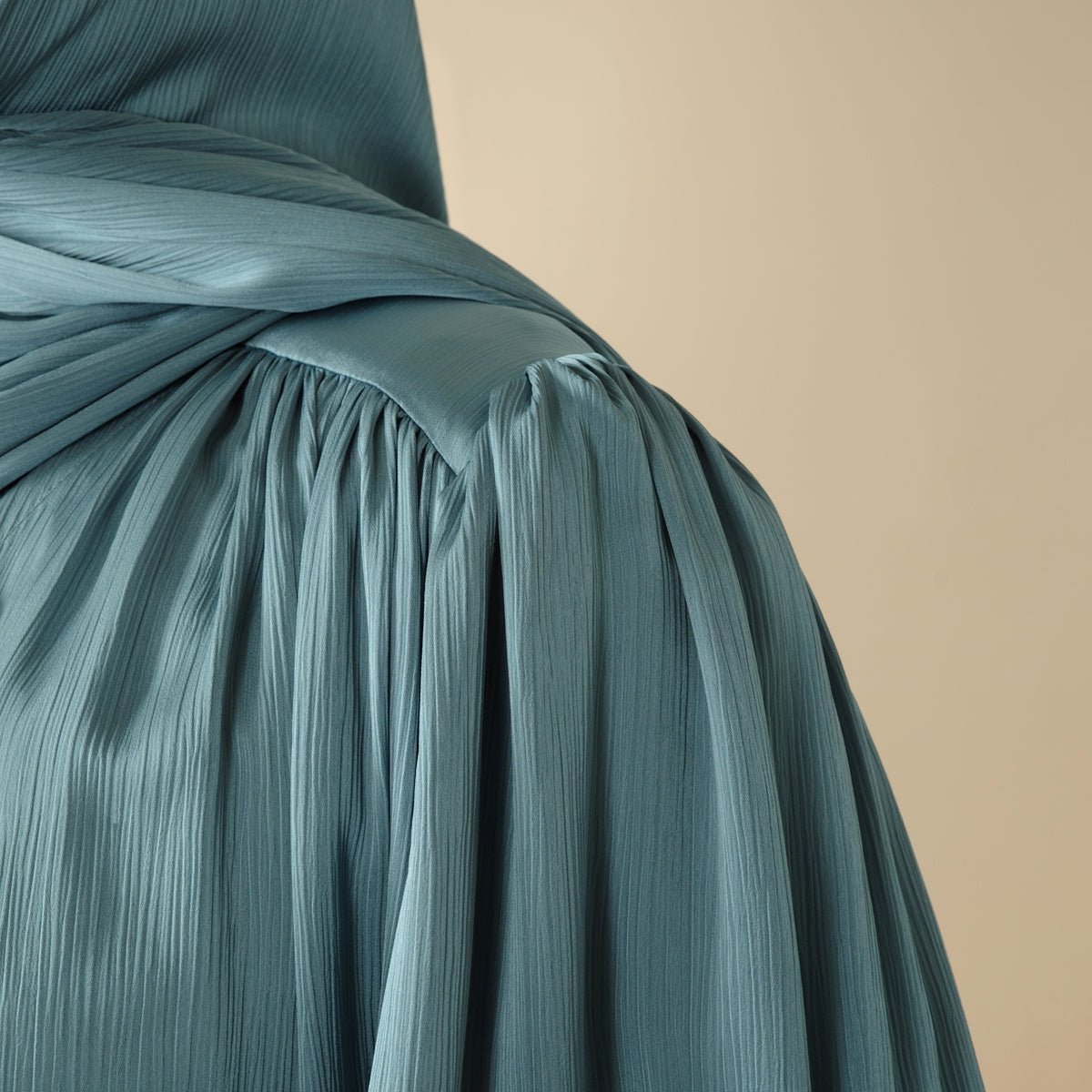 Close-up of horizontal pleated shoulder gathers on crinkle open abaya