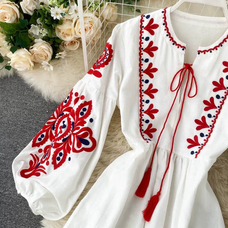 Back view of embroidered linen-look maxi dress with hidden side zip detail