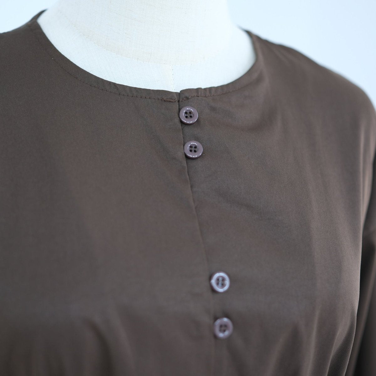 Three-quarter view of button-front longline modest two-piece set
