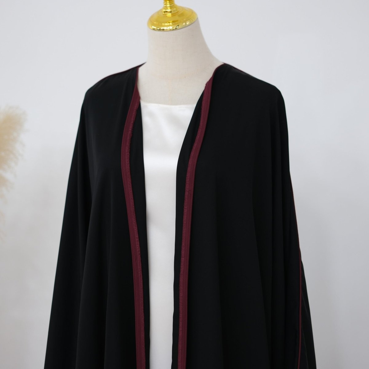 Matte nida fabric texture close-up on batwing sleeve