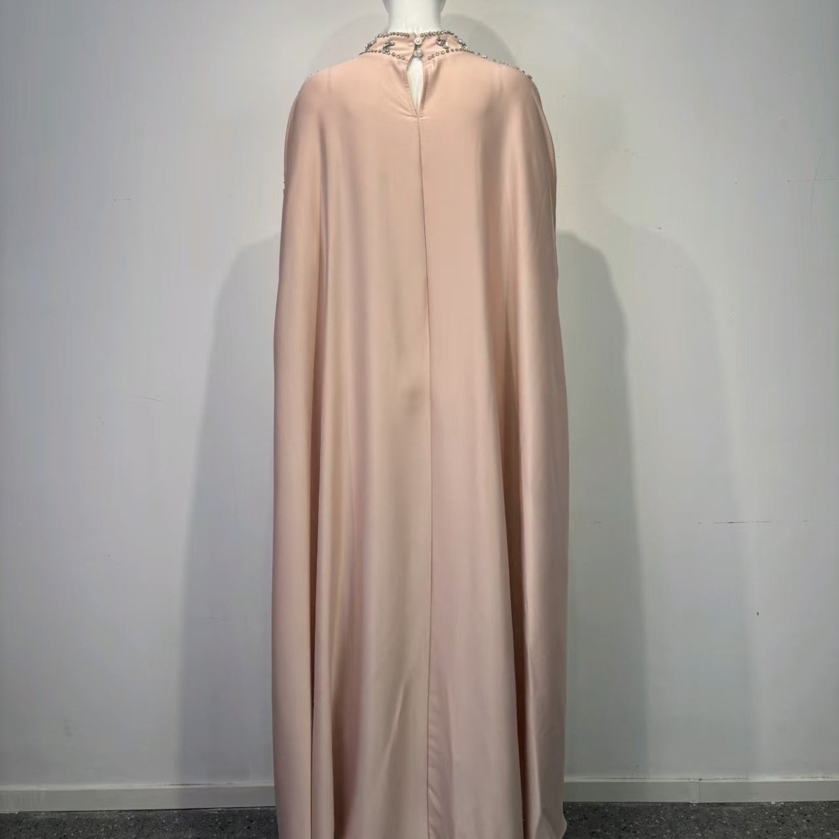 Modest evening cape dress with cascading crystal chain embellishments