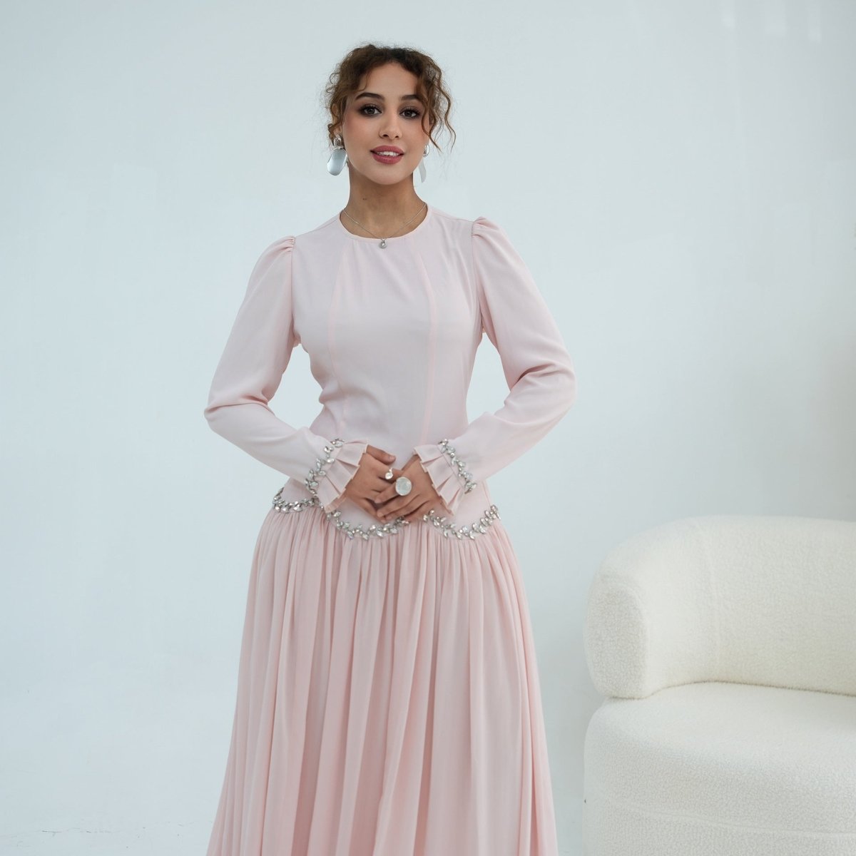 Hand-set oval crystal detail along waist wave