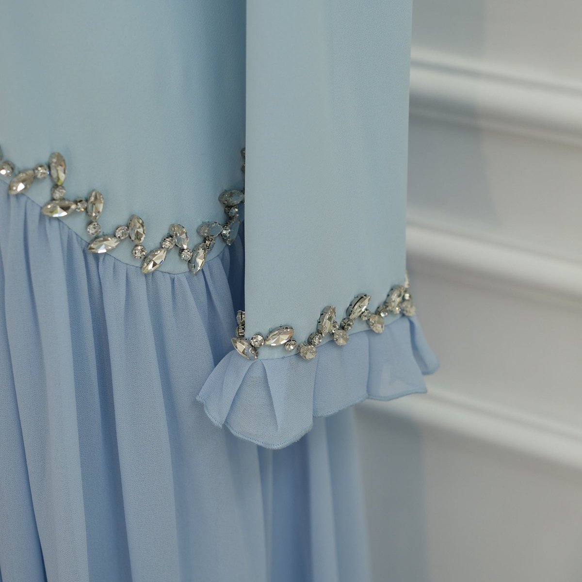 Sleeve cuff and skirt hem shown together
