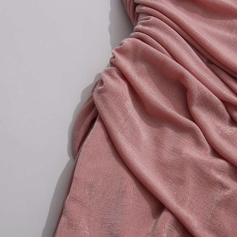 Lower skirt detail showing diagonal ruching gathered at the right hem
