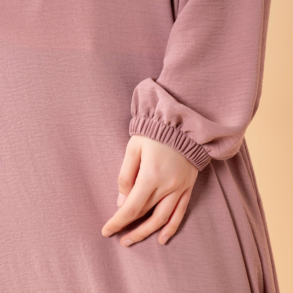 Essential Flow abaya worn with neutral hijab for everyday modest style