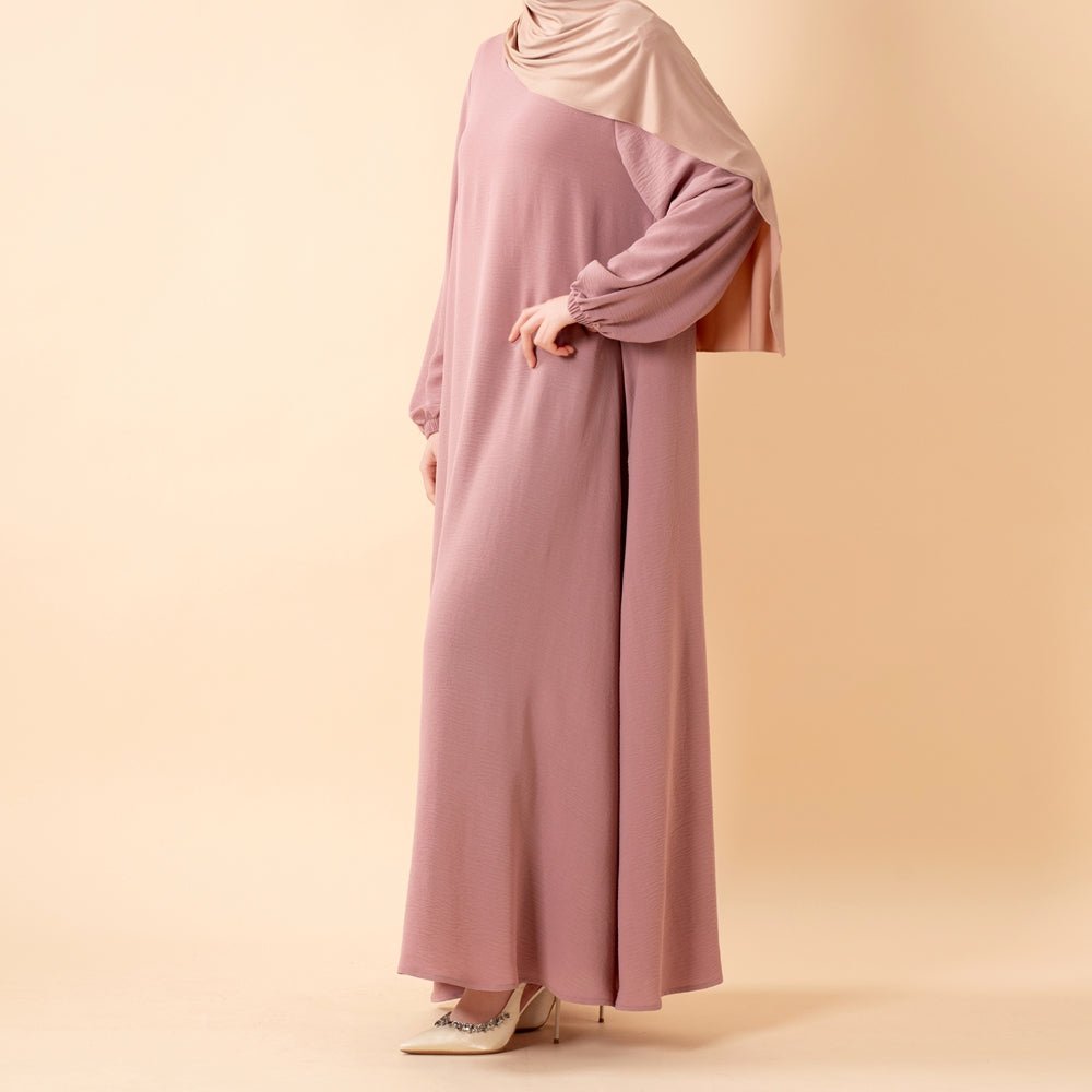 Close-up of deep side pocket on crepe abaya maxi dress