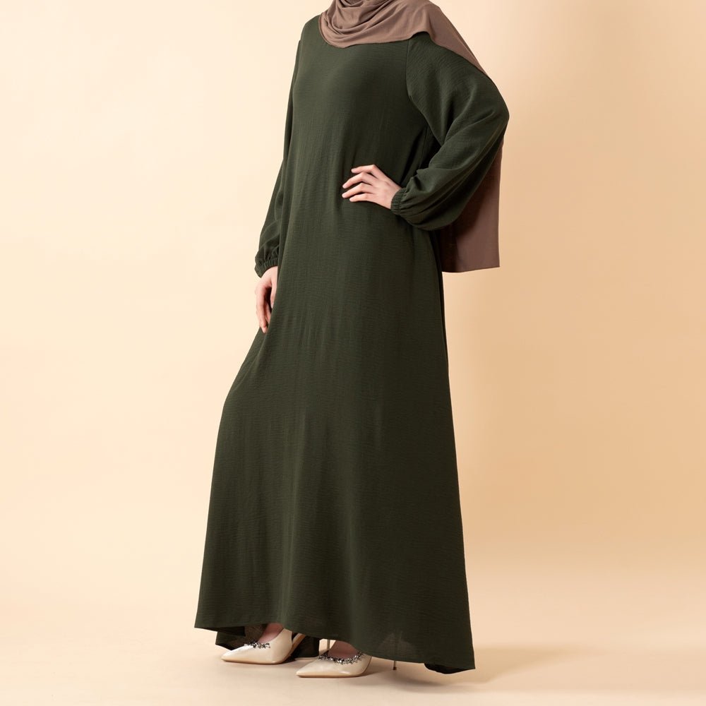 Essential Flow crepe abaya in motion showing elegant drape
