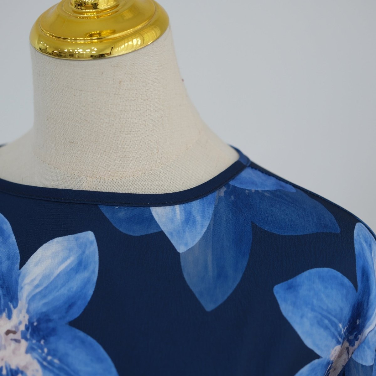 Model walking in floral crinkle abaya dress