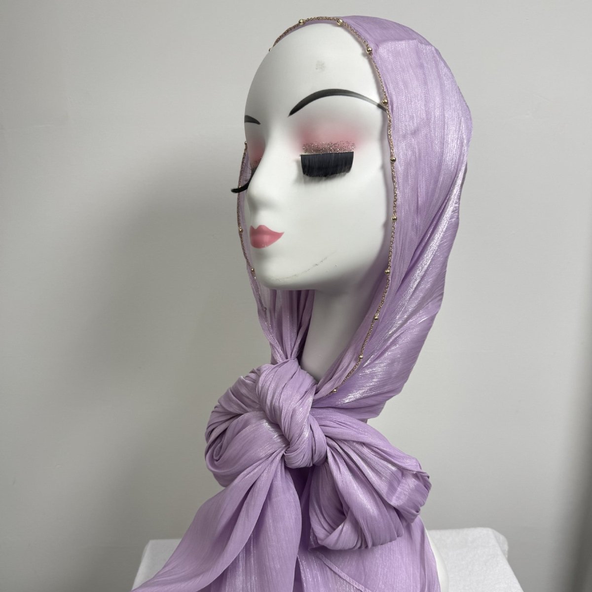 Lightweight satin hijab with metallic chain trim draped naturally