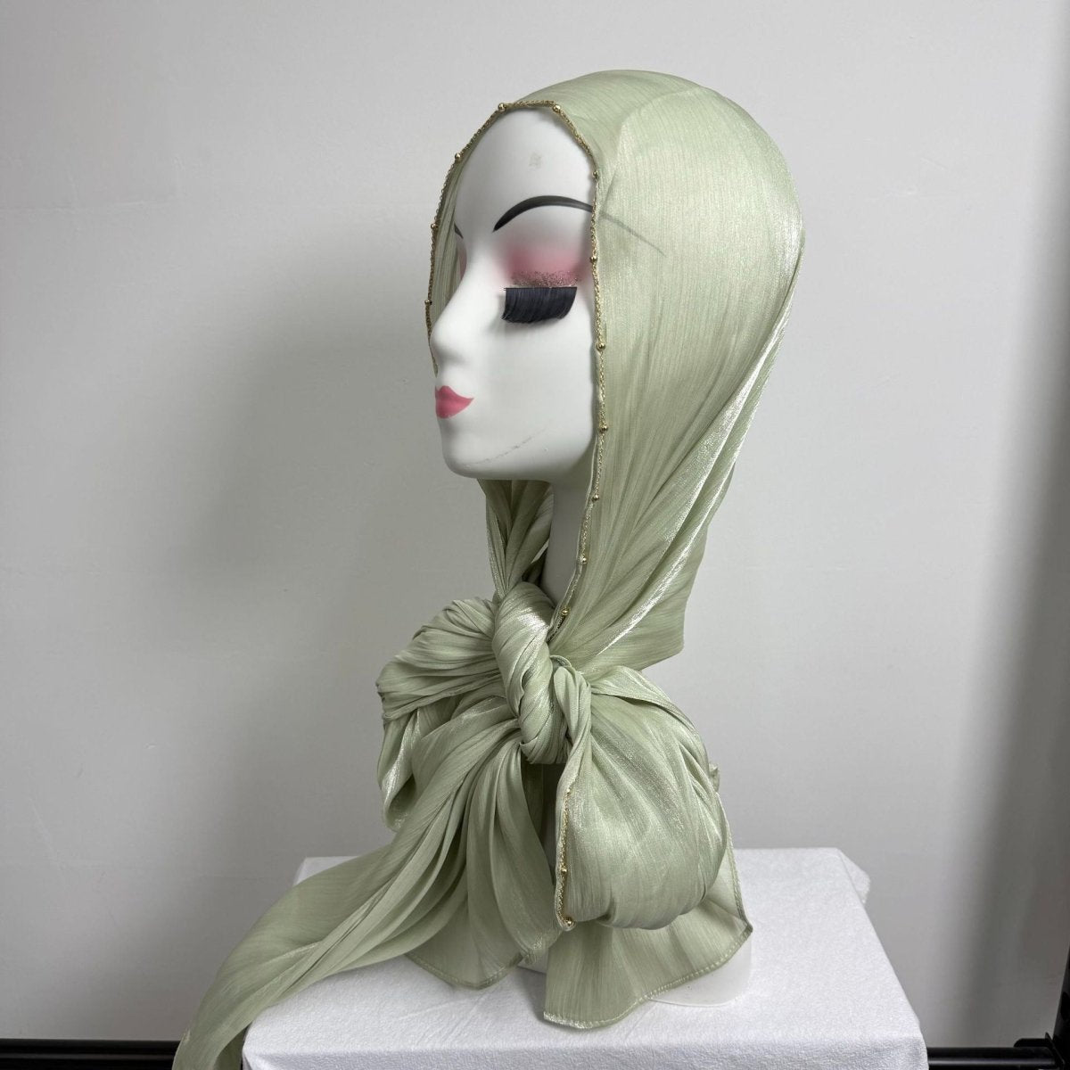 Full scarf length view of crinkle satin hijab with gold beaded trim edge