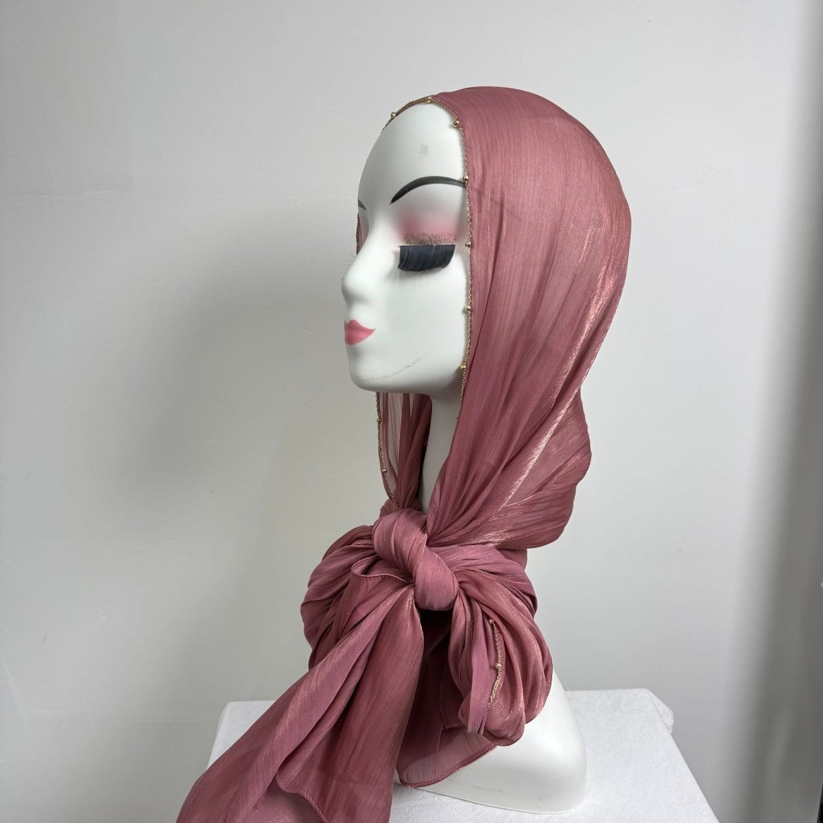 Draped satin hijab showing shimmer finish in natural light