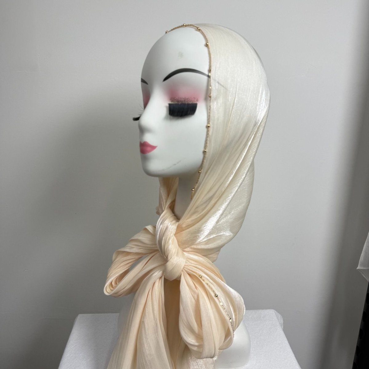 Beaded edge hijab worn as shoulder shawl for versatile styling