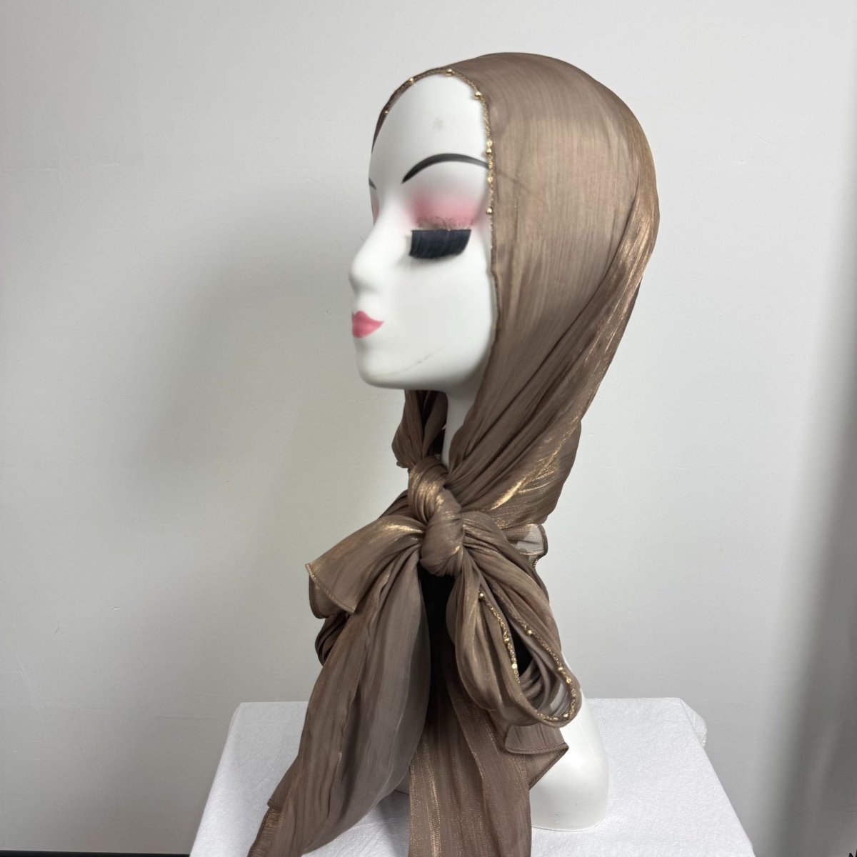 Crinkle satin hijab styled with volume showing natural texture movement