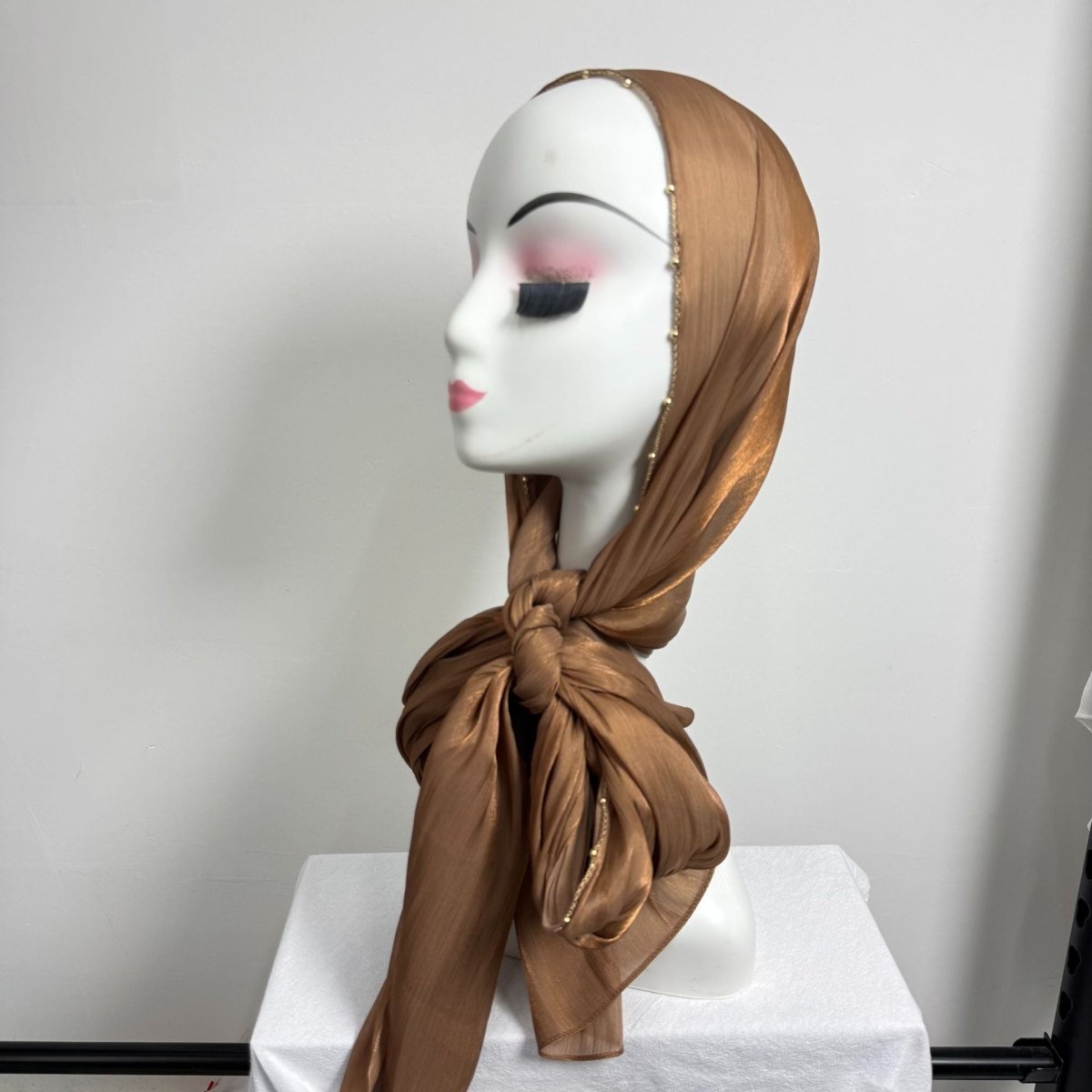Gold chain beaded satin hijab worn styled — elegant and lightweight