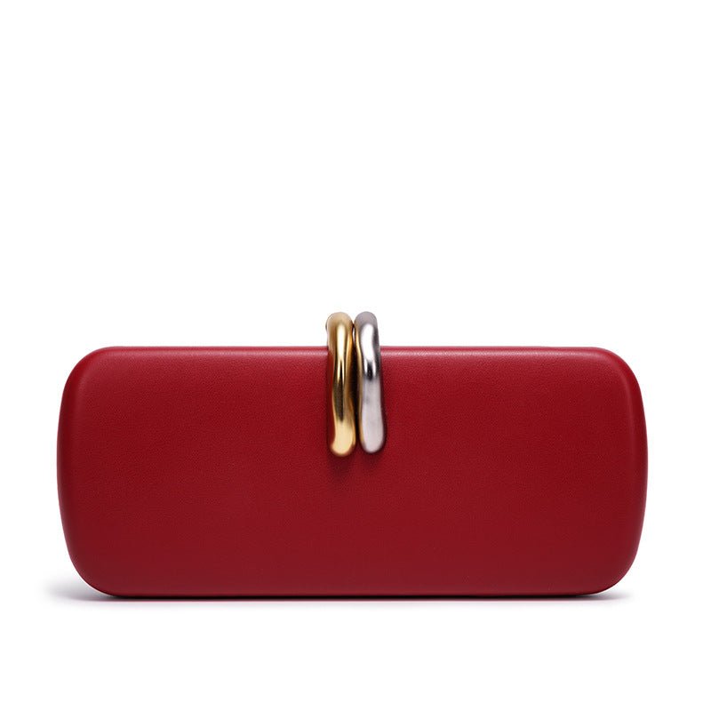 Clutch held in hand to show scale and proportion