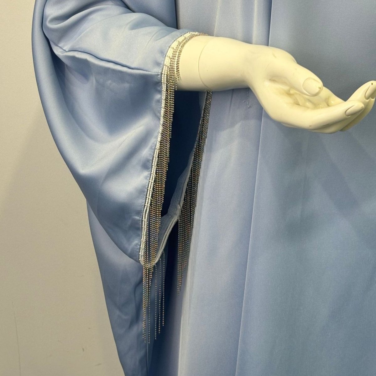 Lake blue satin kaftan with dense hand-applied crystal beadwork