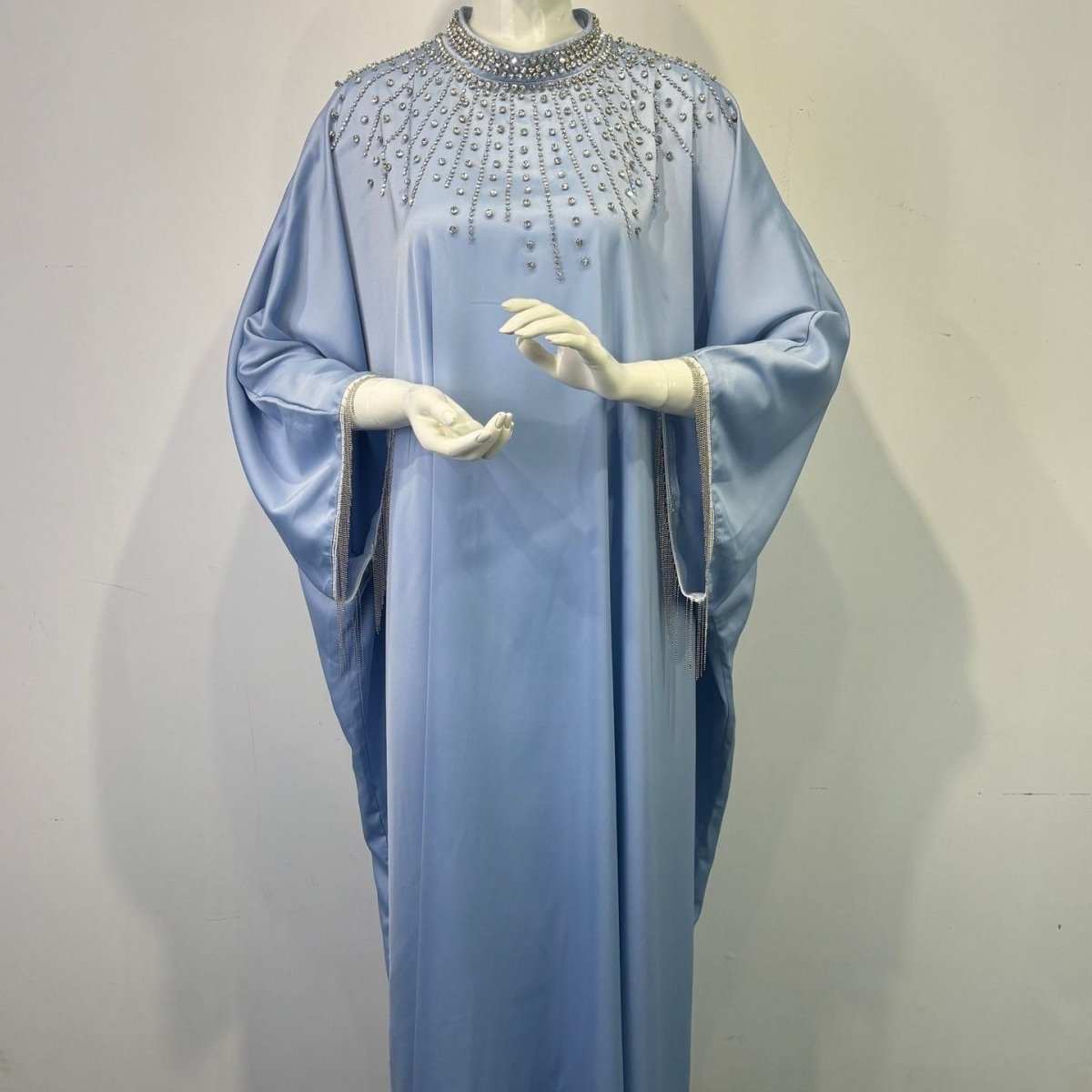 Hand-beaded kaftan with sunburst crystal strands across shoulder and chest