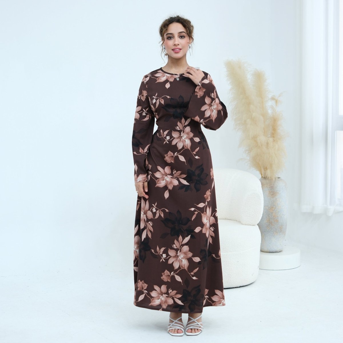 Dramatic bell sleeve detail of ink floral satin maxi dress