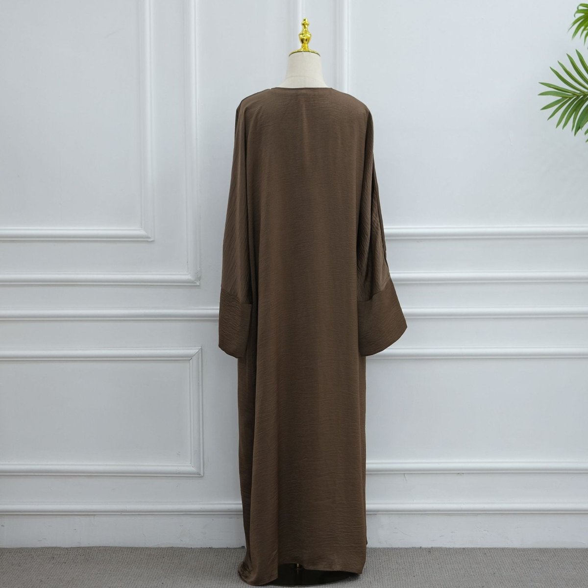 Slender self-tie belt threaded through waist loops