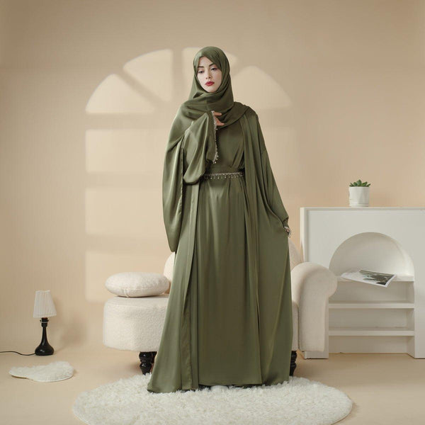 Modern satin abaya with matching diamond tassel belt - example of contemporary modest wear
