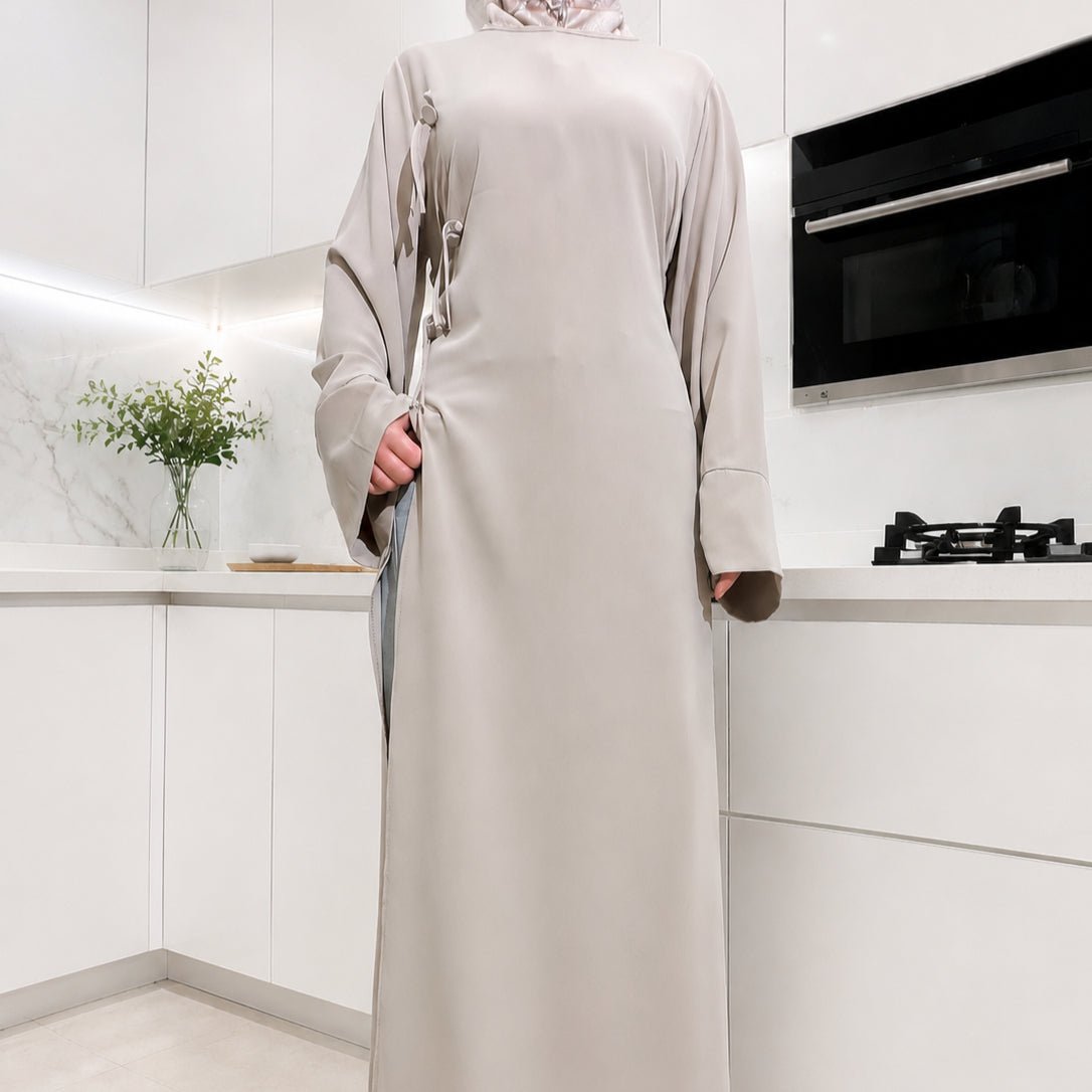 Flowing batwing sleeves of Nida longline tunic top in motion