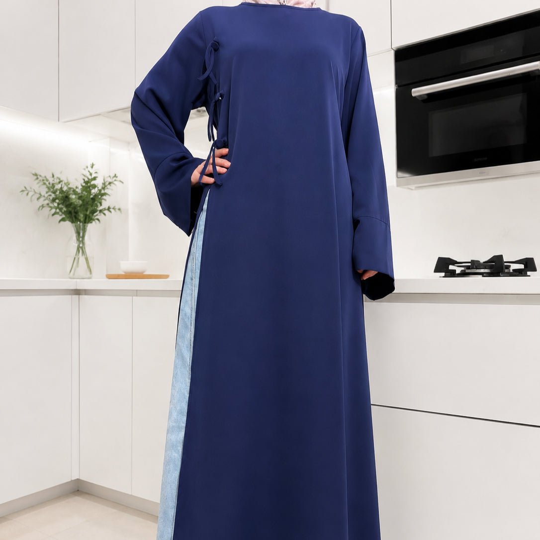 Three-quarter view of longline Nida tunic showing high side slit and hem length