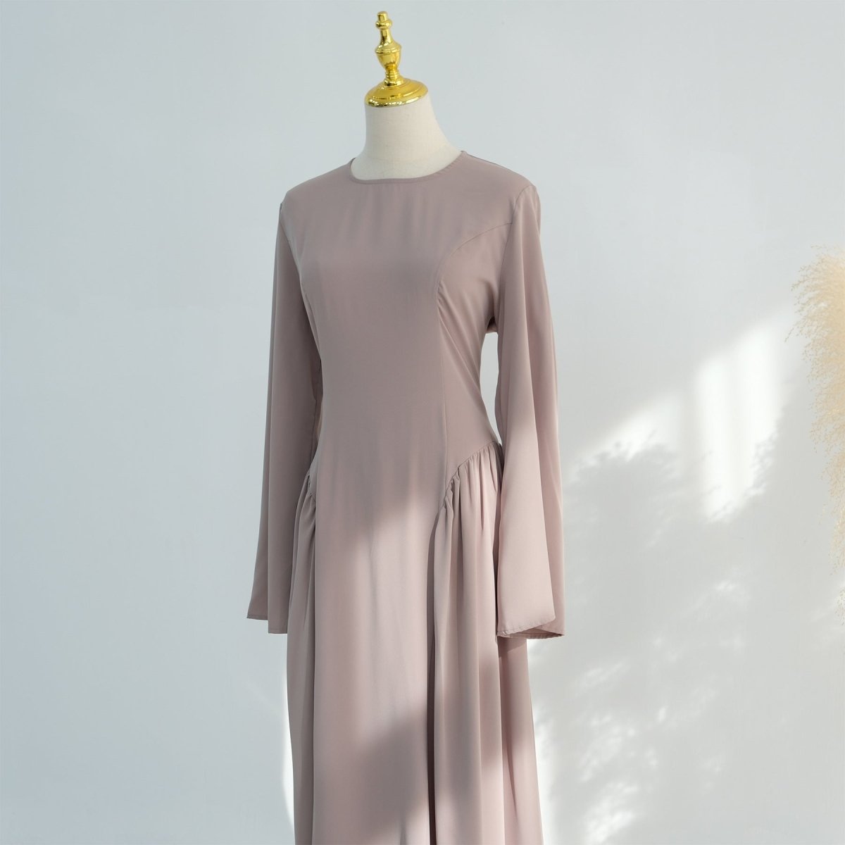 Full-length front view of opaque nida flared maxi dress