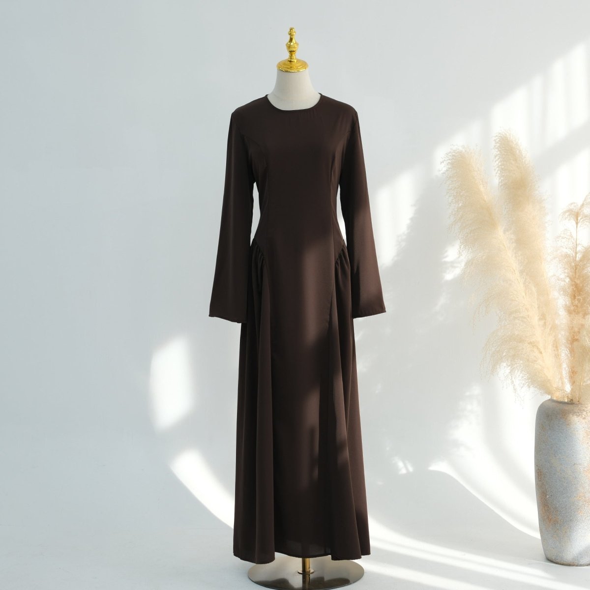 Full-length back view of nida flared maxi dress with sweeping A-line skirt
