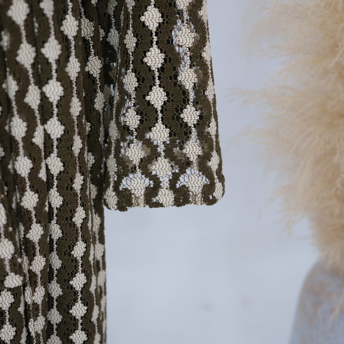 Lace open abaya in alternate colourway showing distinct knit construction