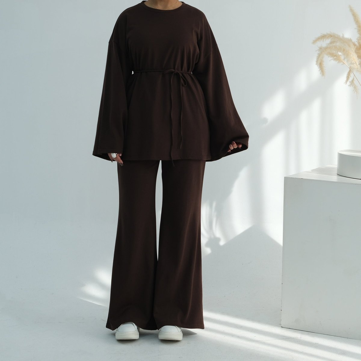 Flared cuff sleeve detail on oversized batwing cotton top