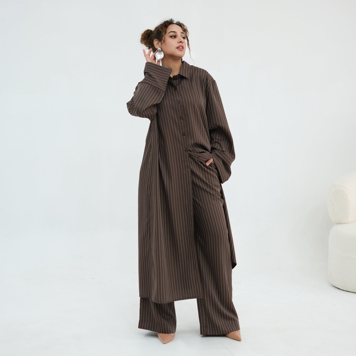 Side pocket detail on the wide-leg pinstripe trousers
