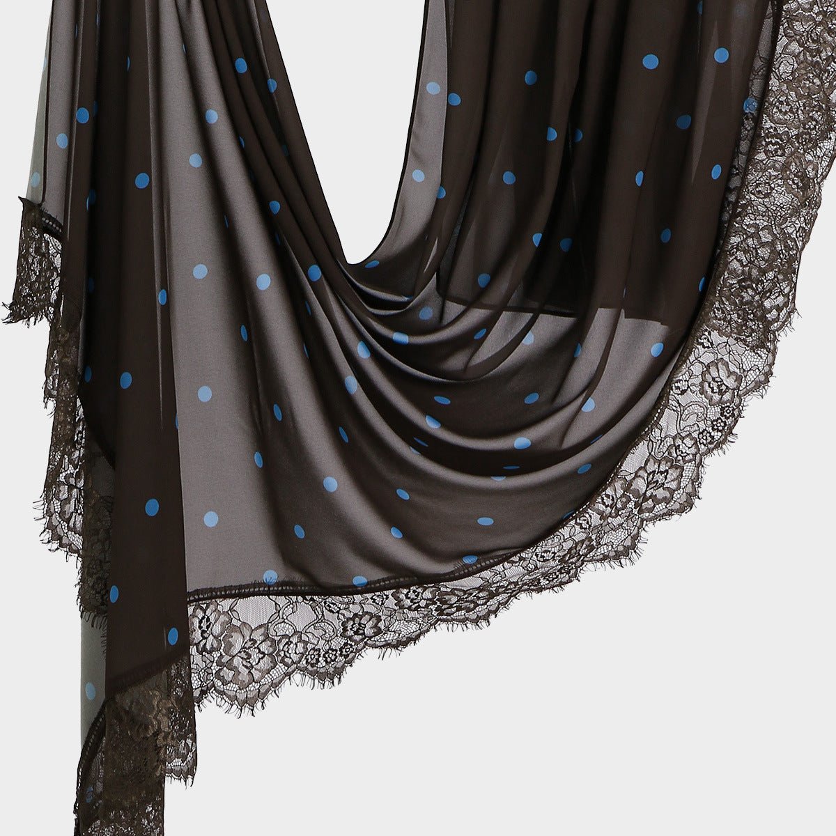 Detail shot of open floral motif and fine mesh lace border on printed hijab