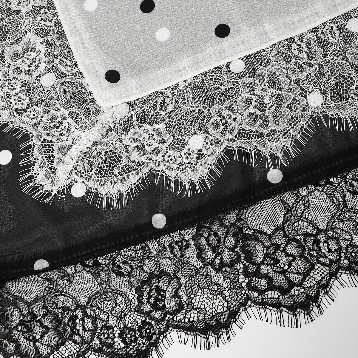 White with black dot printed hijab showing eyelash fringe border detail