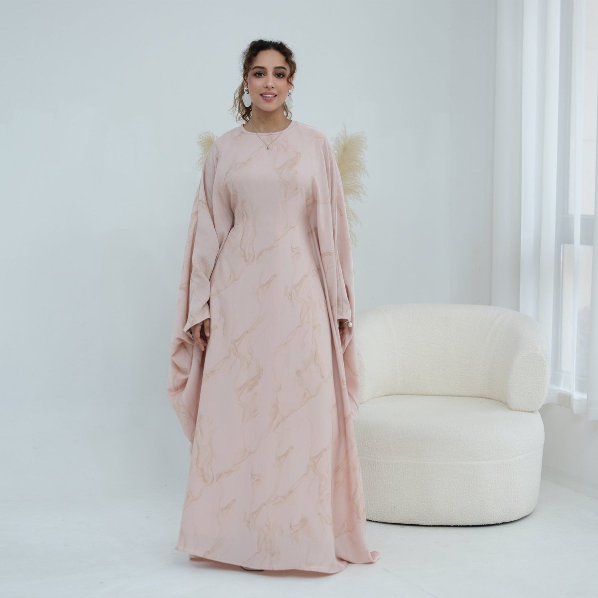 Flowing hem detail of batwing sleeve abaya maxi dress
