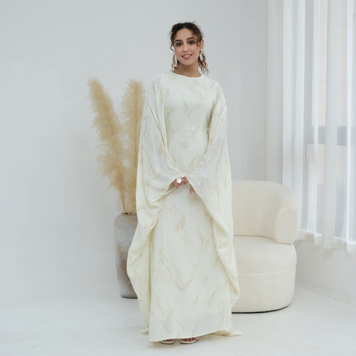 Flowing A-line silhouette of modest maxi dress in lightweight fabric