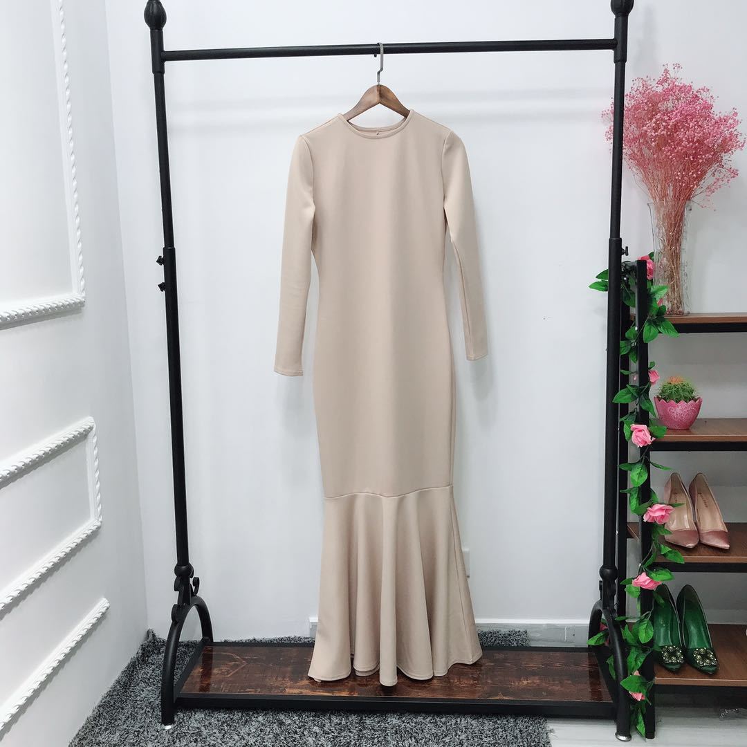 Side profile of bodycon modest dress showing fitted waist and hip silhouette