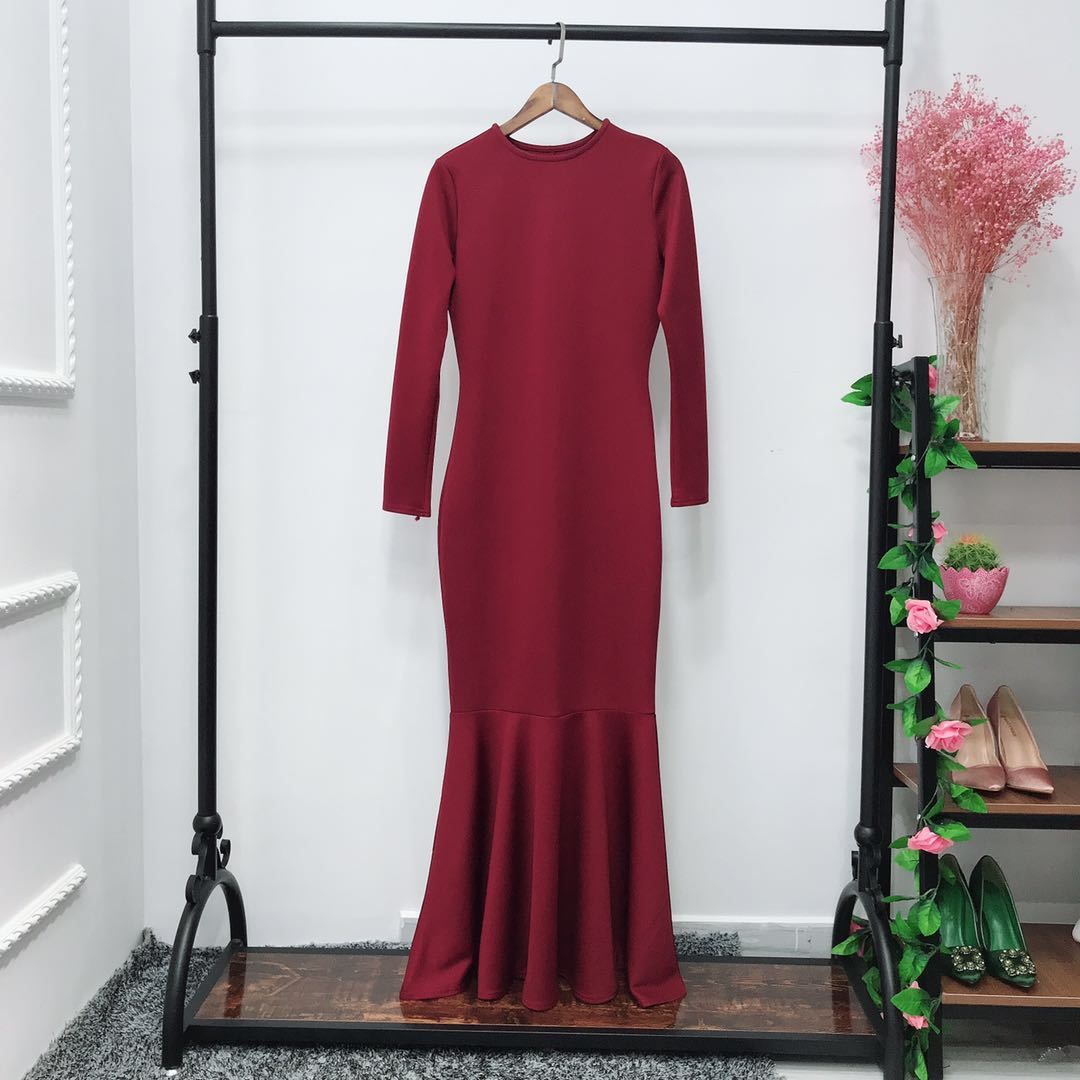 Detail of round neckline and long sleeve cuff on stretch maxi dress