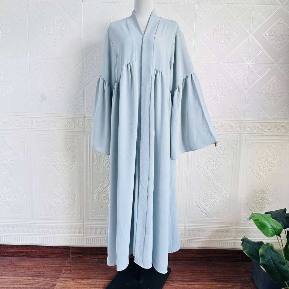 Dark coffee tiered abaya with graceful flowing layered silhouette