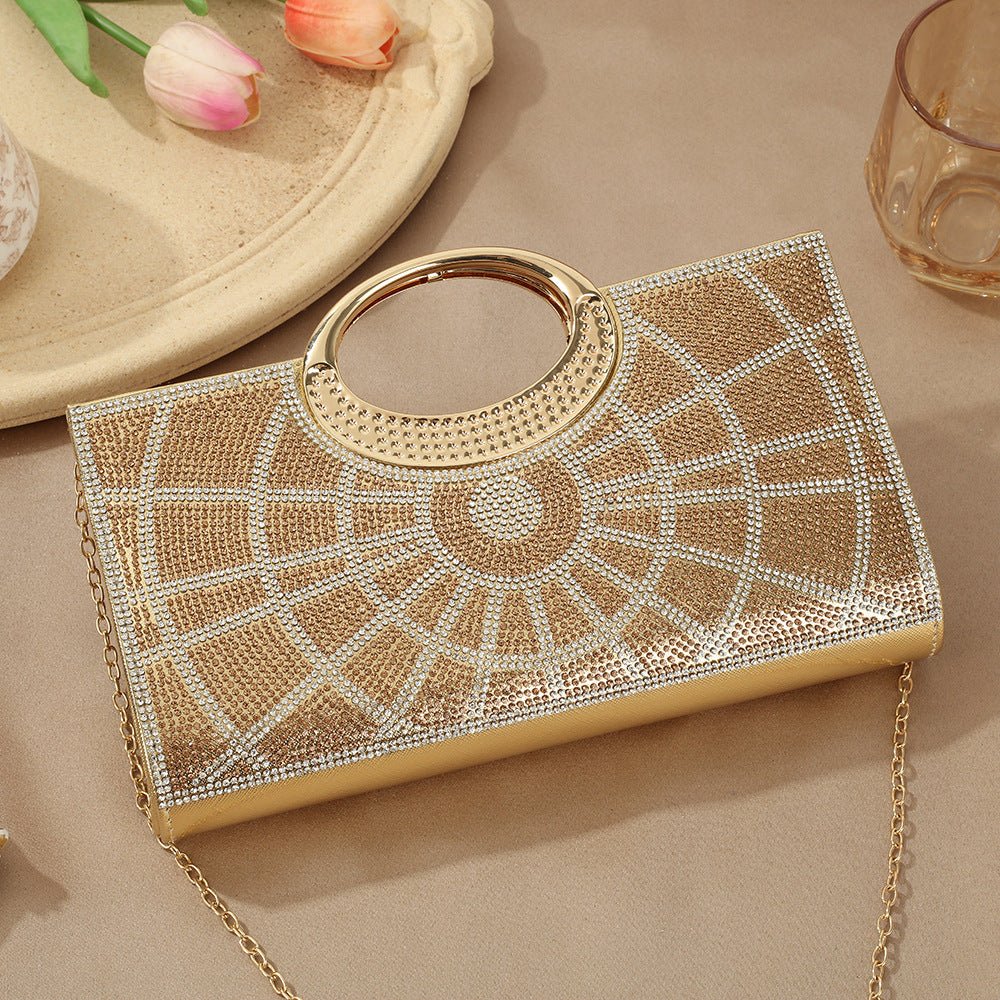 Gold circular metal handle detail on rhinestone sparkly clutch bag