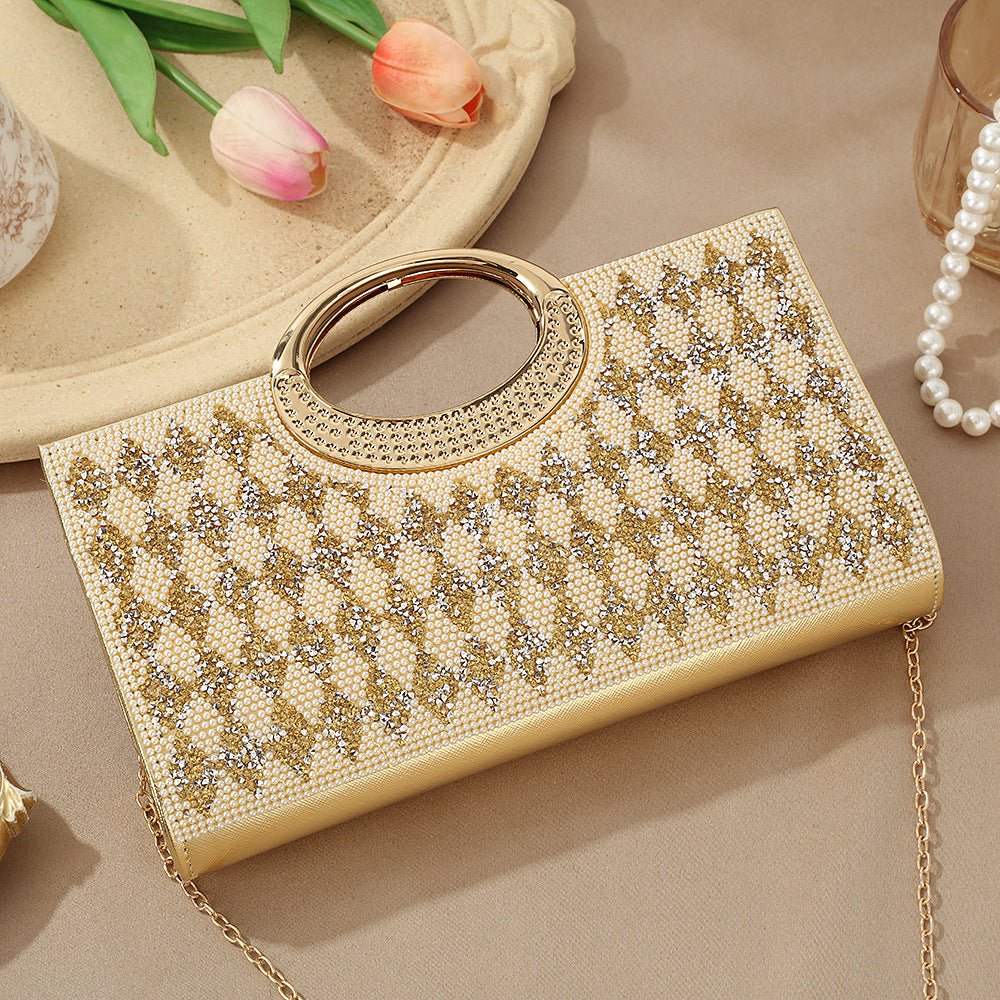 Rhinestone bridal clutch bag placed beside kaftan fabric swatch
