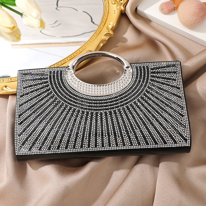 Rhinestone clutch bag with black-tone circular handle detail