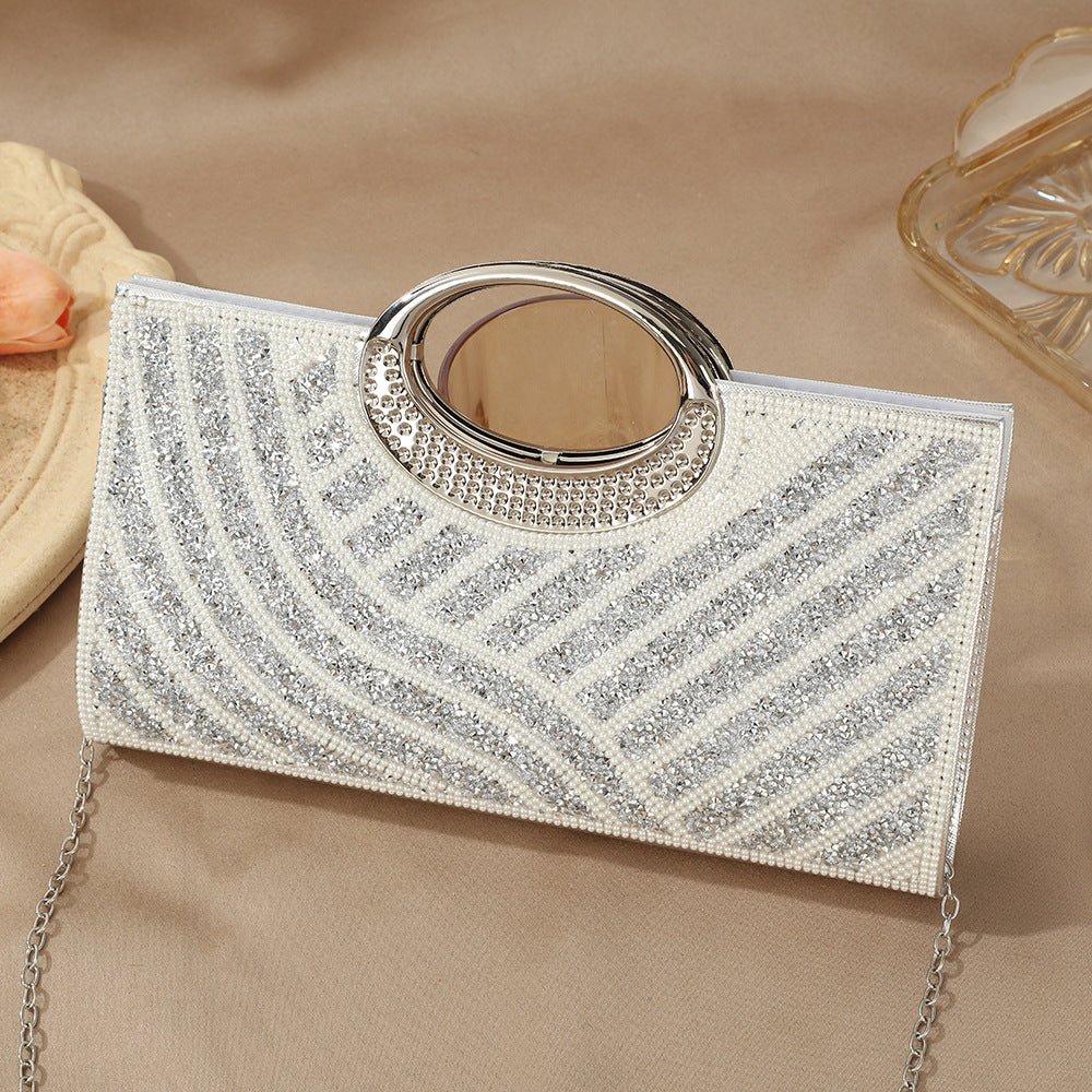 Sparkly clutch bag detail showing individual rhinestone placement