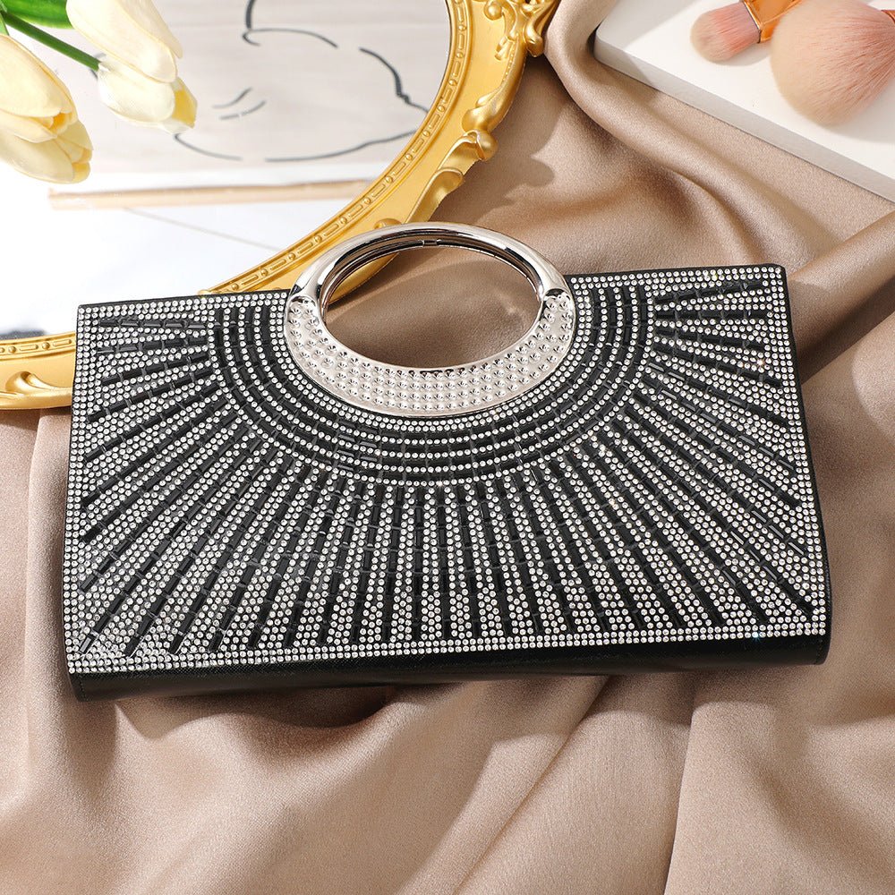 Sparkly clutch bag three-quarter view showing structured form and depth