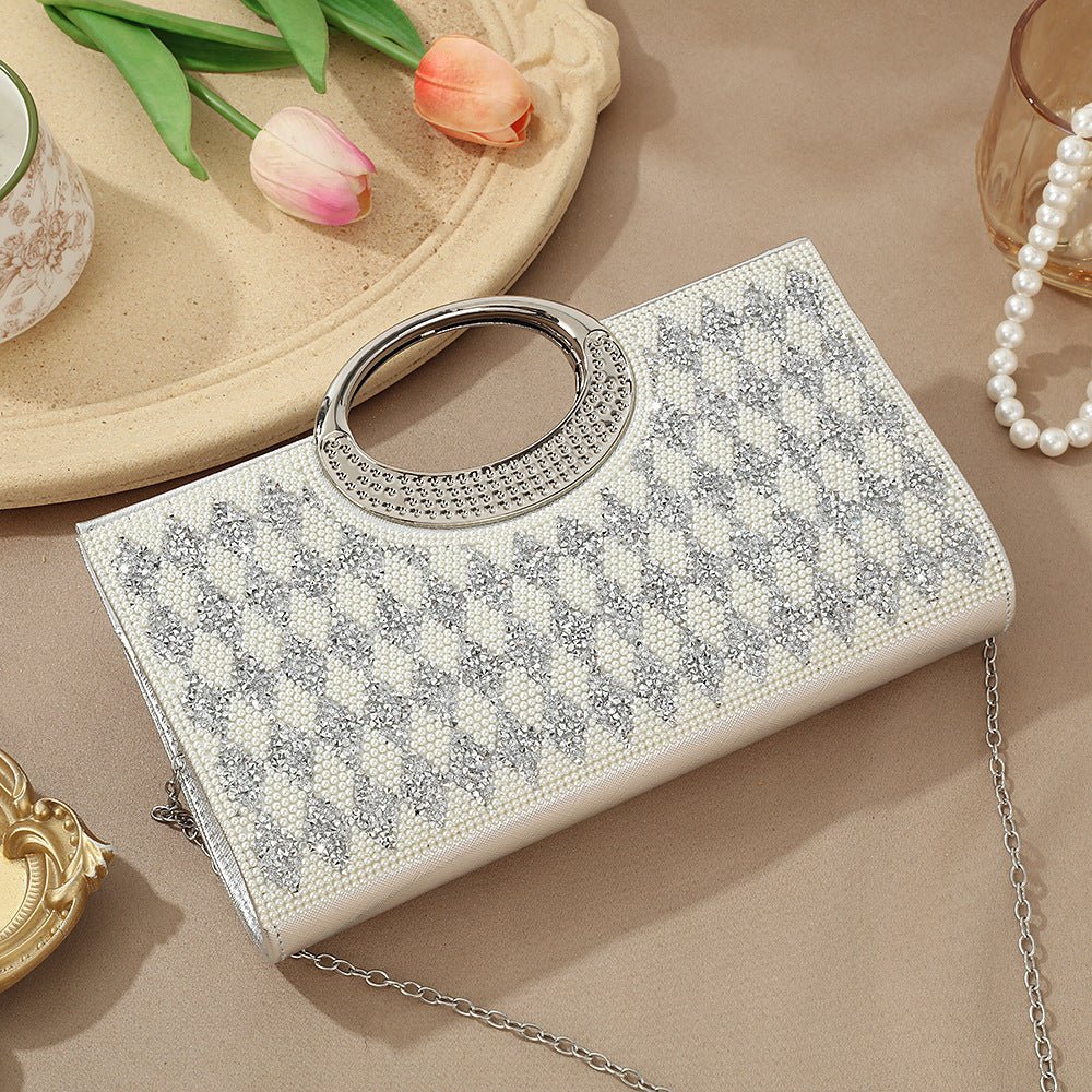 Sparkly evening clutch bag on velvet surface showing luxe aesthetic