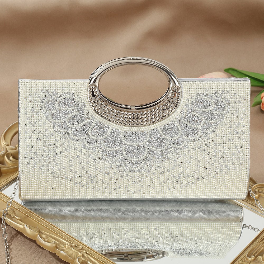 Rhinestone clutch bag styled with gold jewellery for formal evening look
