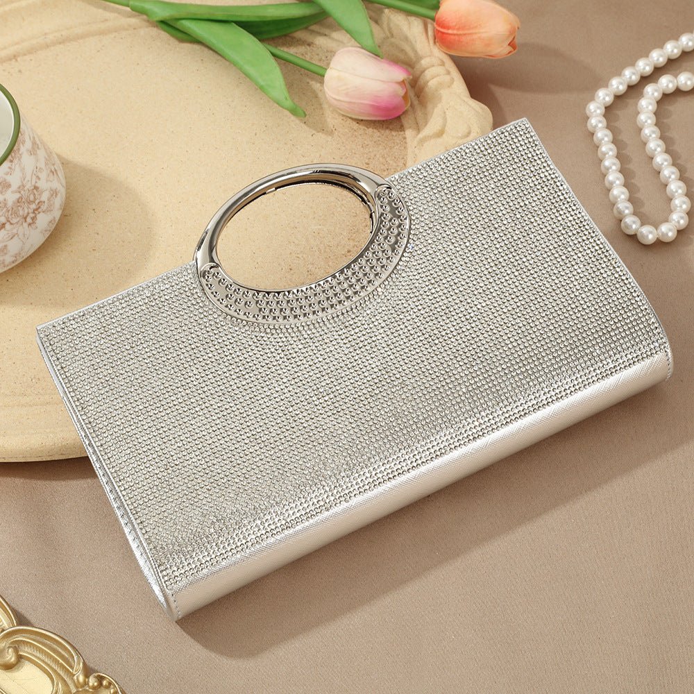 Top-down view of rhinestone clutch bag showing full encrusted surface