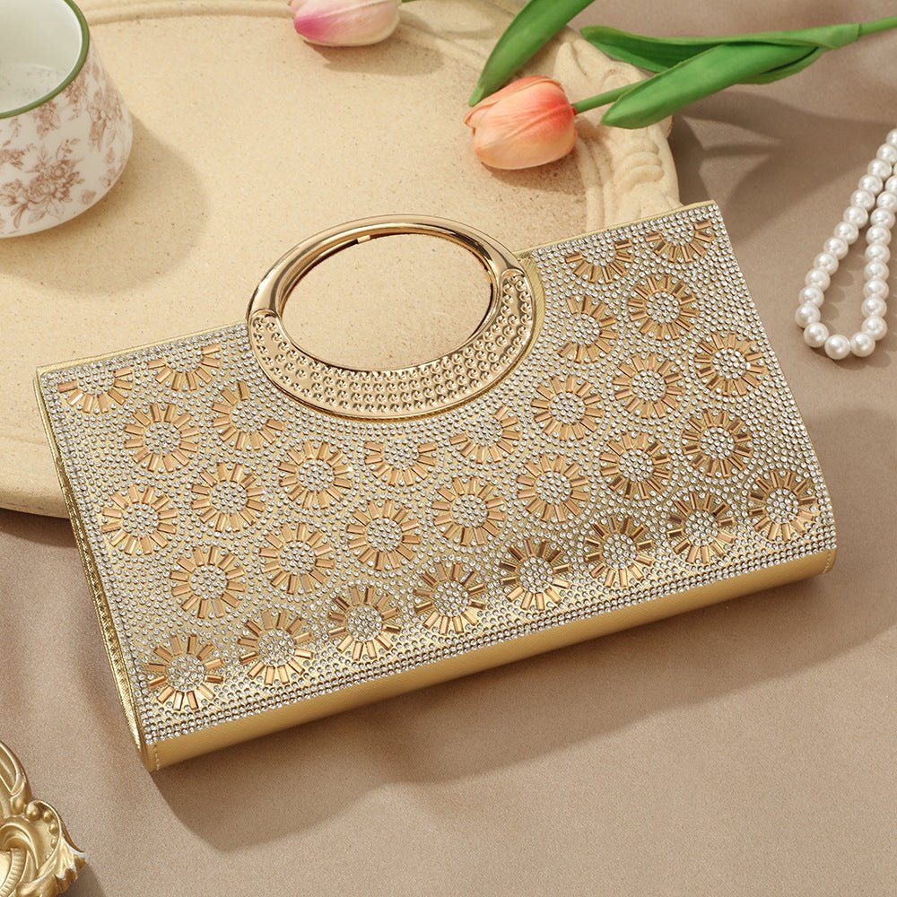 Side profile of sparkly hardshell clutch bag showing rhinestone encrusting