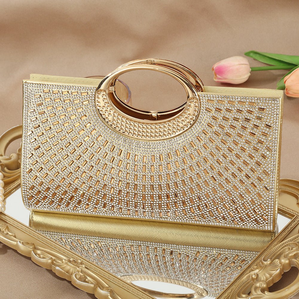 Sparkly evening clutch bag photographed against dark background for dramatic effect