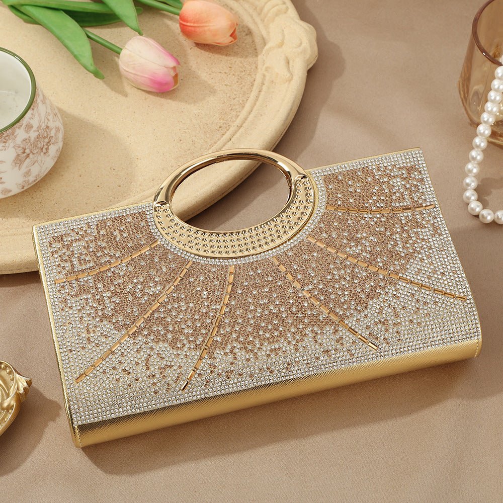 Silver-tone hardware circular handle close-up on sparkly evening clutch